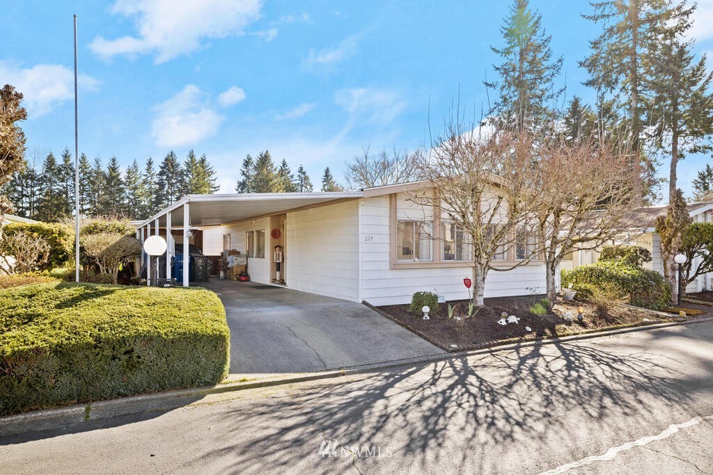 201 Union Avenue Southeast, Unit 224 Renton, WA 98059 - Photo 2 of 23 a view of a house with a yard