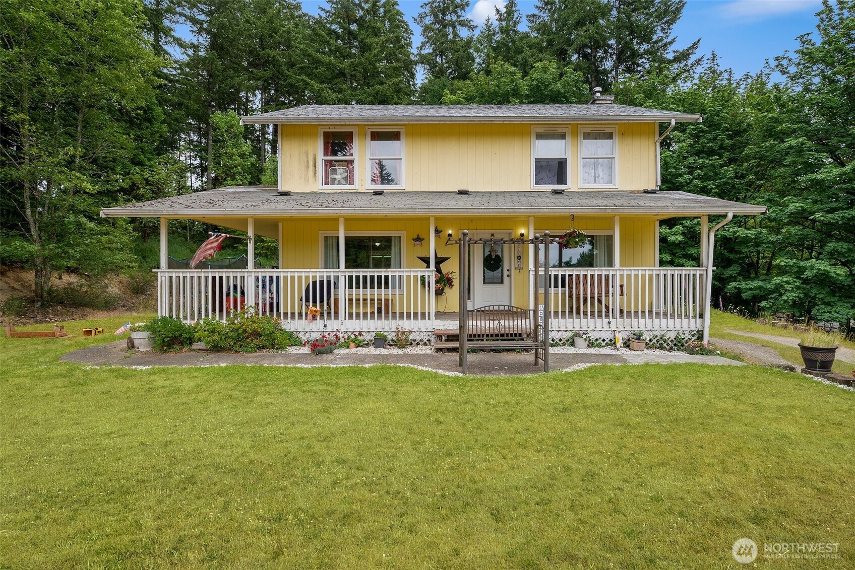 1471 Southeast Binns Swiger Loop Road Shelton, WA 98584 - Photo 1 of 13 a view of a house with a yard and sitting area