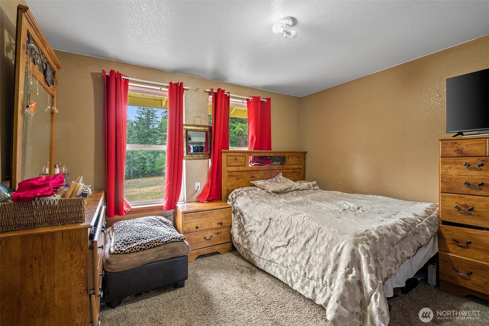 1471 Southeast Binns Swiger Loop Road Shelton, WA 98584 - Photo 12 of 13 a bedroom with a bed and a flat screen tv