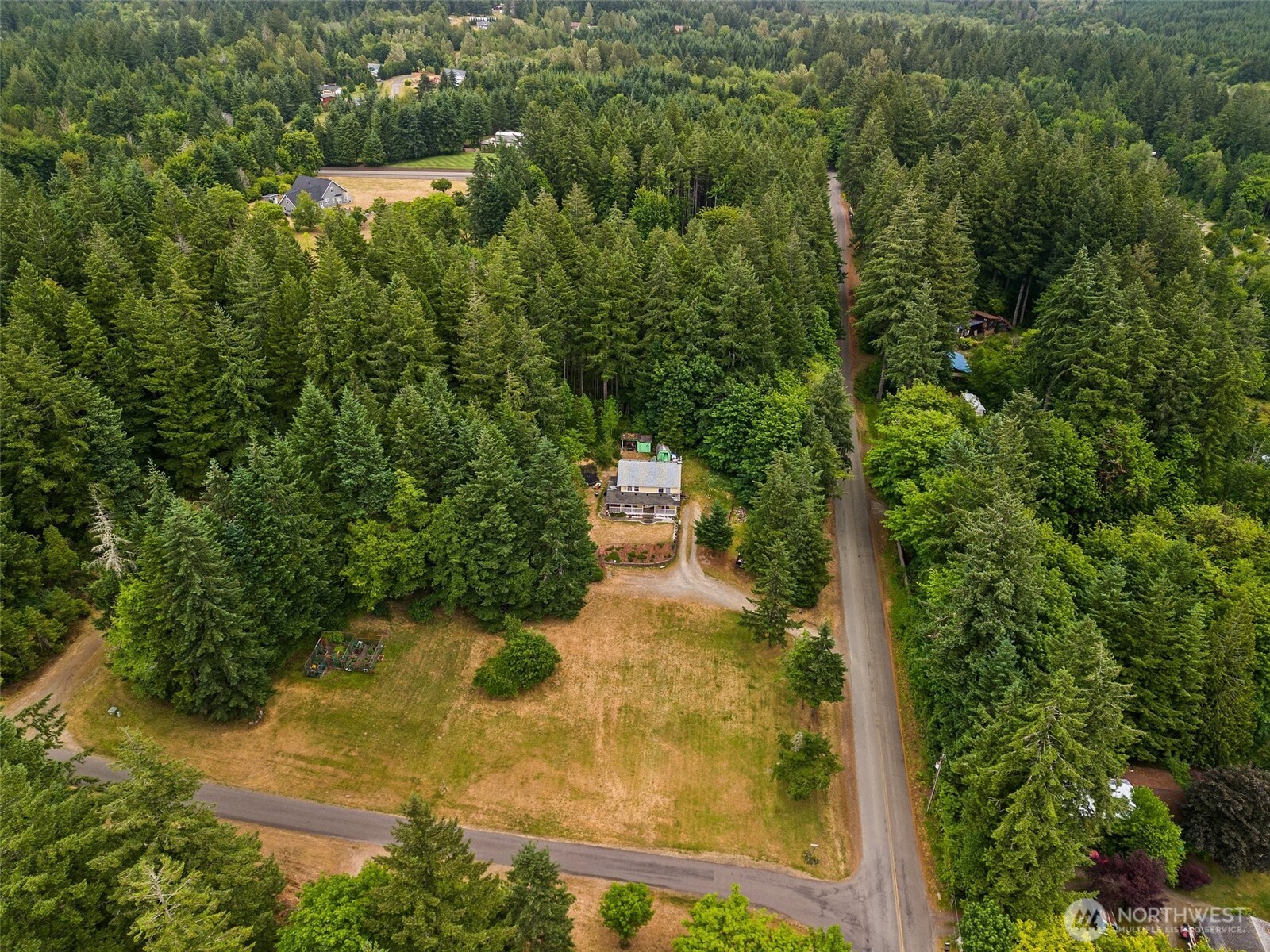1471 Southeast Binns Swiger Loop Road Shelton, WA 98584 - Photo 3 of 13 an aerial view of a residential houses with yard