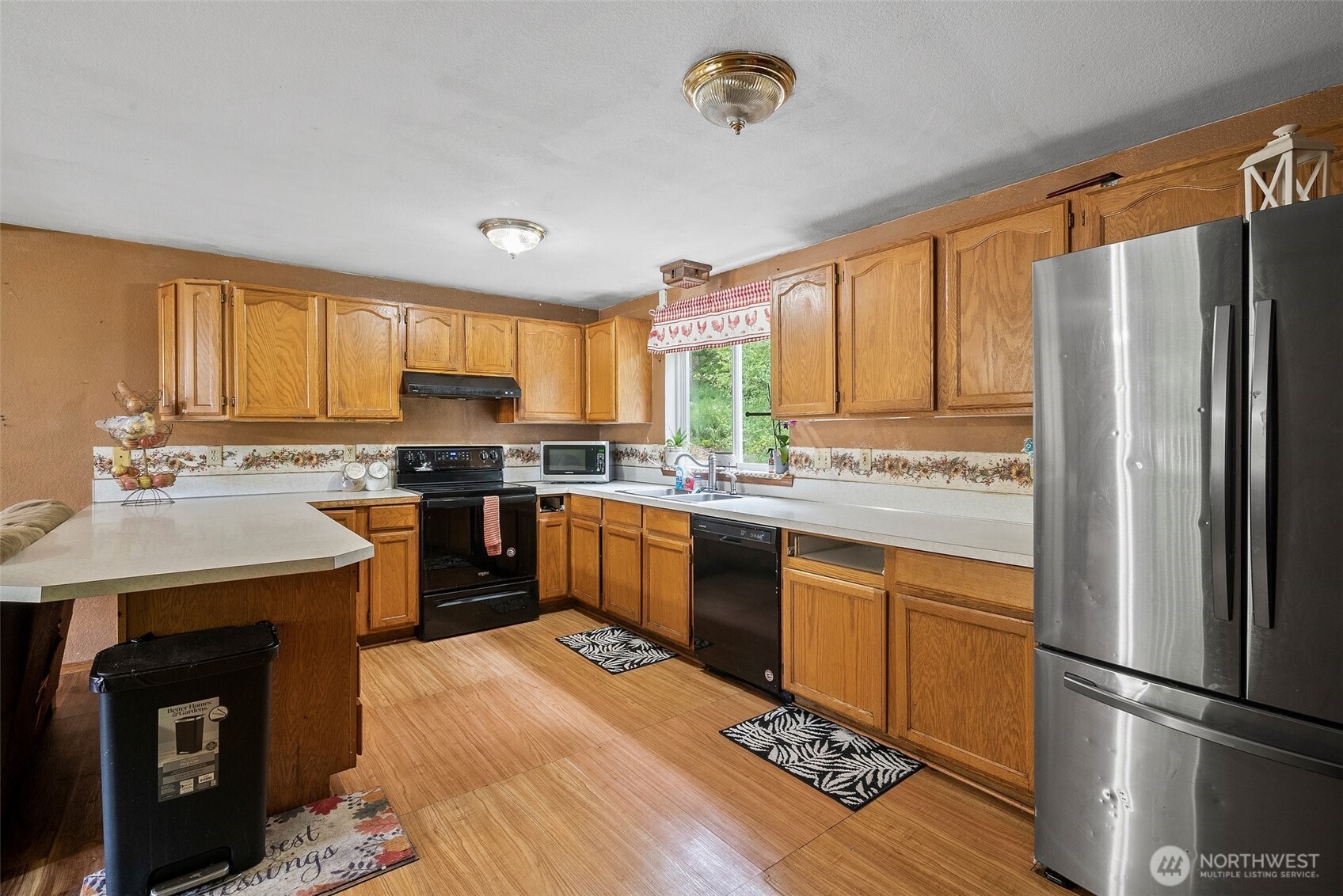 1471 Southeast Binns Swiger Loop Road Shelton, WA 98584 - Photo 8 of 13 a kitchen with a refrigerator sink and cabinets