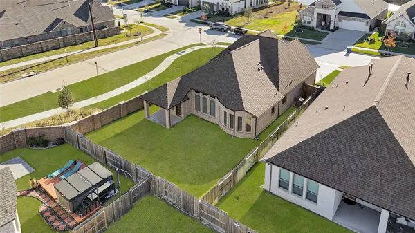 an aerial view of a house with swimming pool