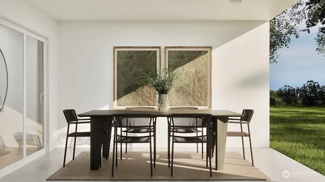 a view of a dining room with furniture and garden view