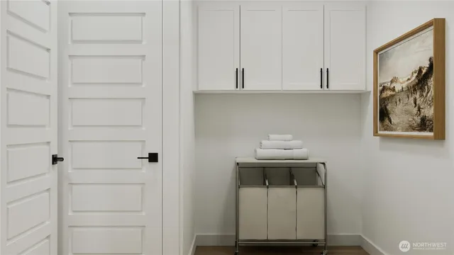 a room with a bench and cabinets