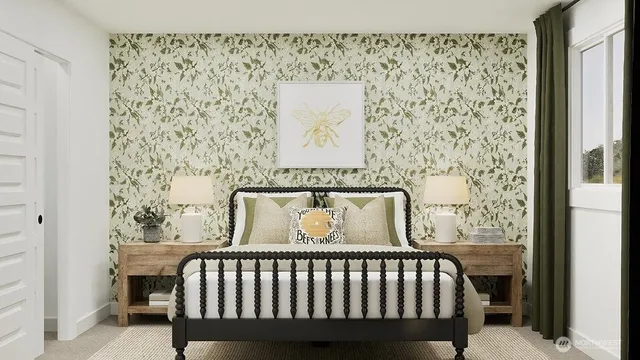 a bed sitting in a bedroom next to a window