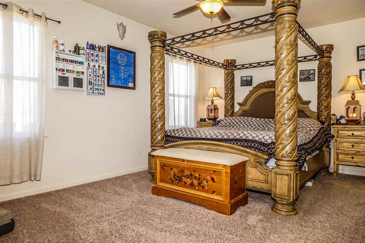 1860 Golden Ranch Road Fruita, CO 81521 - Photo 11 of 27 a bed sitting in a room next to a window