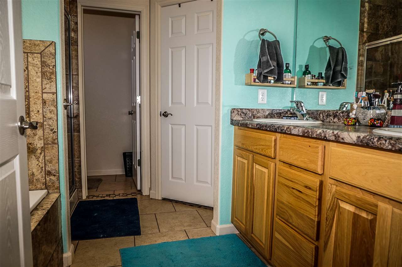 1860 Golden Ranch Road Fruita, CO 81521 - Photo 12 of 27 a bathroom with mirror and sink
