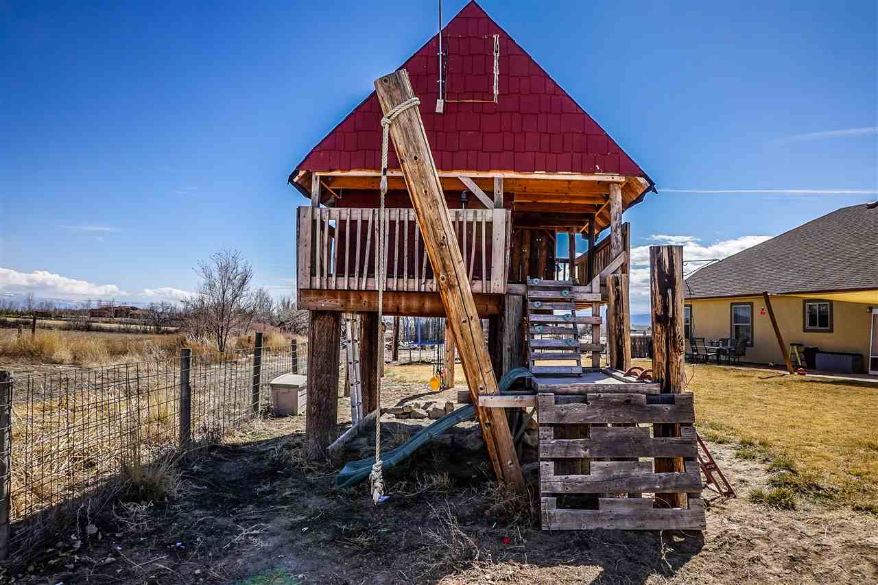 1860 Golden Ranch Road Fruita, CO 81521 - Photo 21 of 27 a front view of a house with a yard balcony