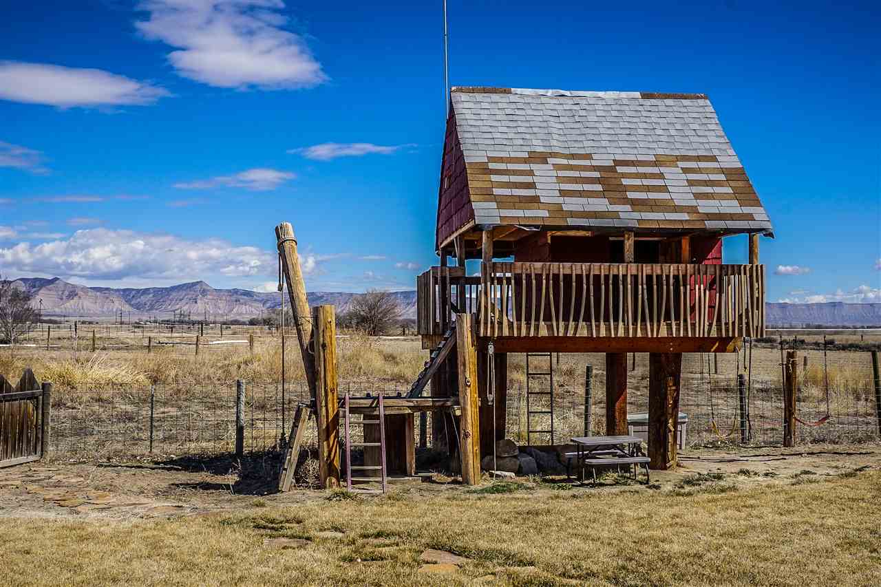 1860 Golden Ranch Road Fruita, CO 81521 - Photo 22 of 27 a front view of a house with a yard