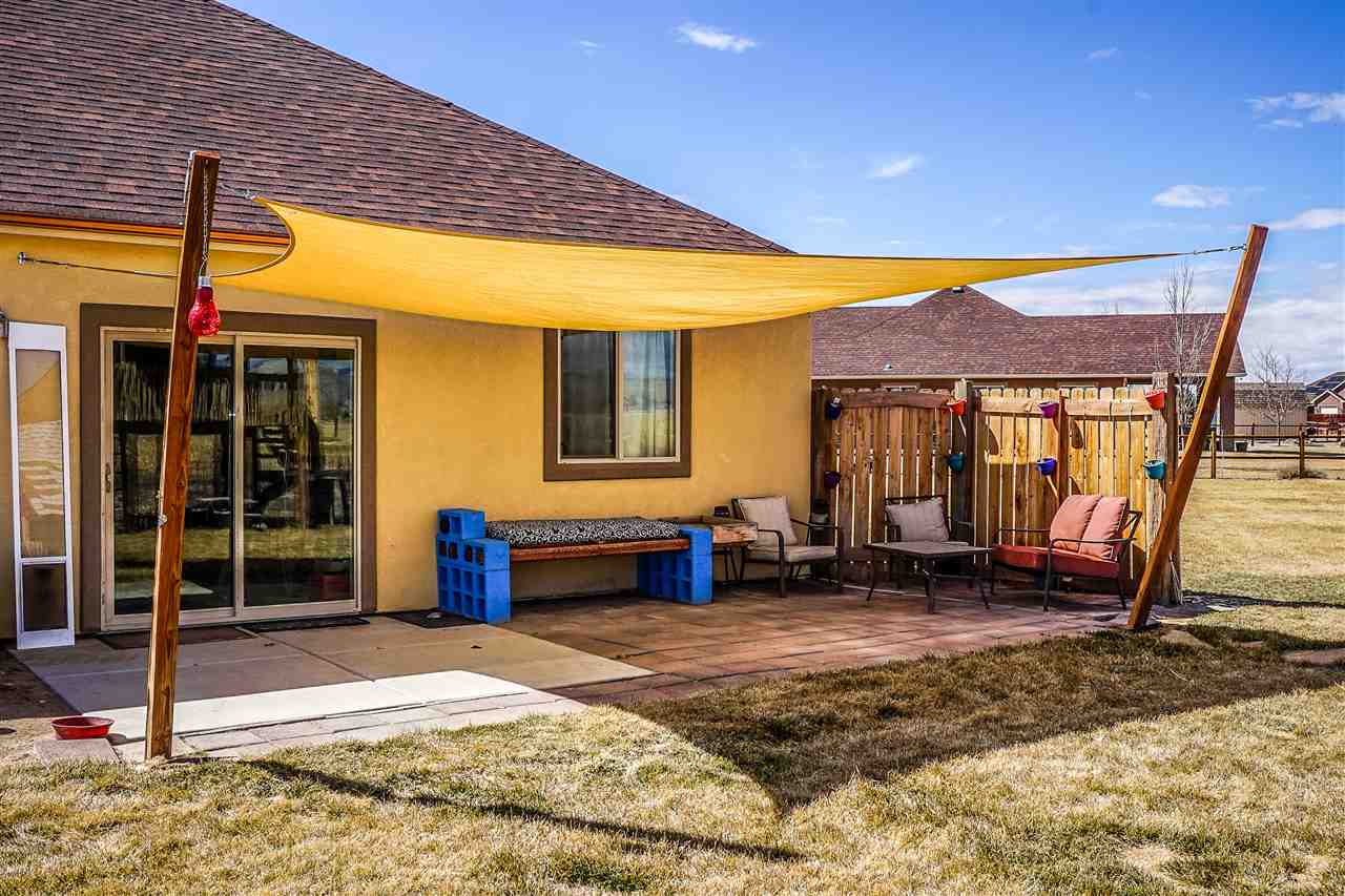 1860 Golden Ranch Road Fruita, CO 81521 - Photo 23 of 27 a backyard of a house with seating space