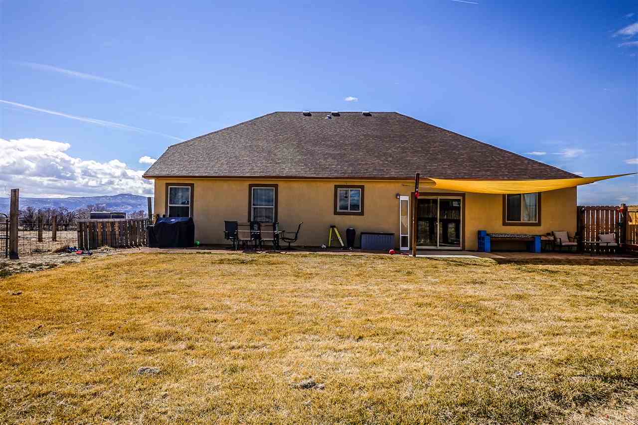 1860 Golden Ranch Road Fruita, CO 81521 - Photo 24 of 27 a front view of a house with a yard