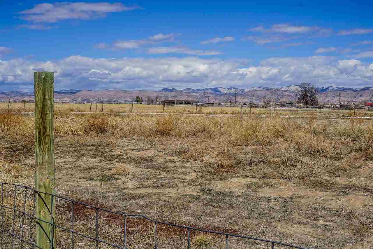 1860 Golden Ranch Road Fruita, CO 81521 - Photo 26 of 27 a view of a lake with a mountain in the background