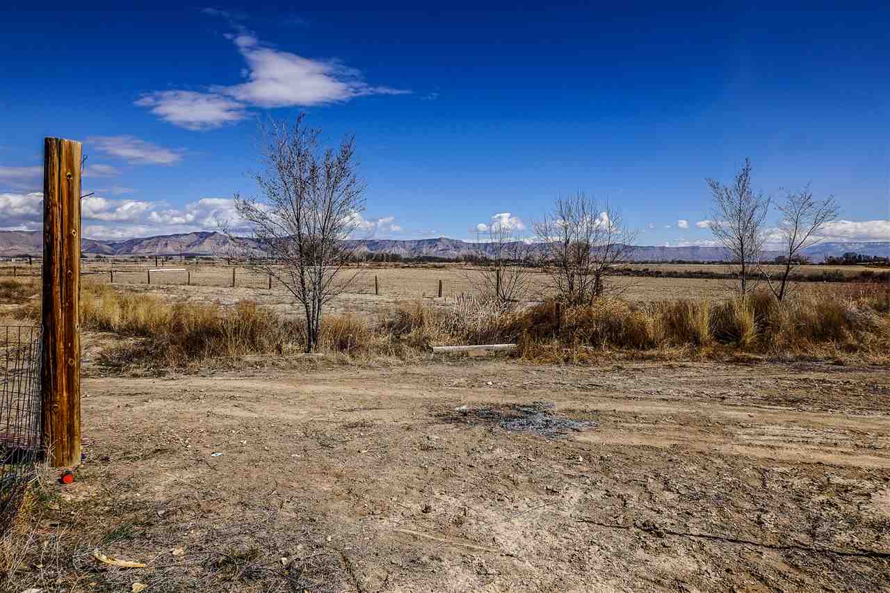 1860 Golden Ranch Road Fruita, CO 81521 - Photo 27 of 27 a view of a yard with wooden fence