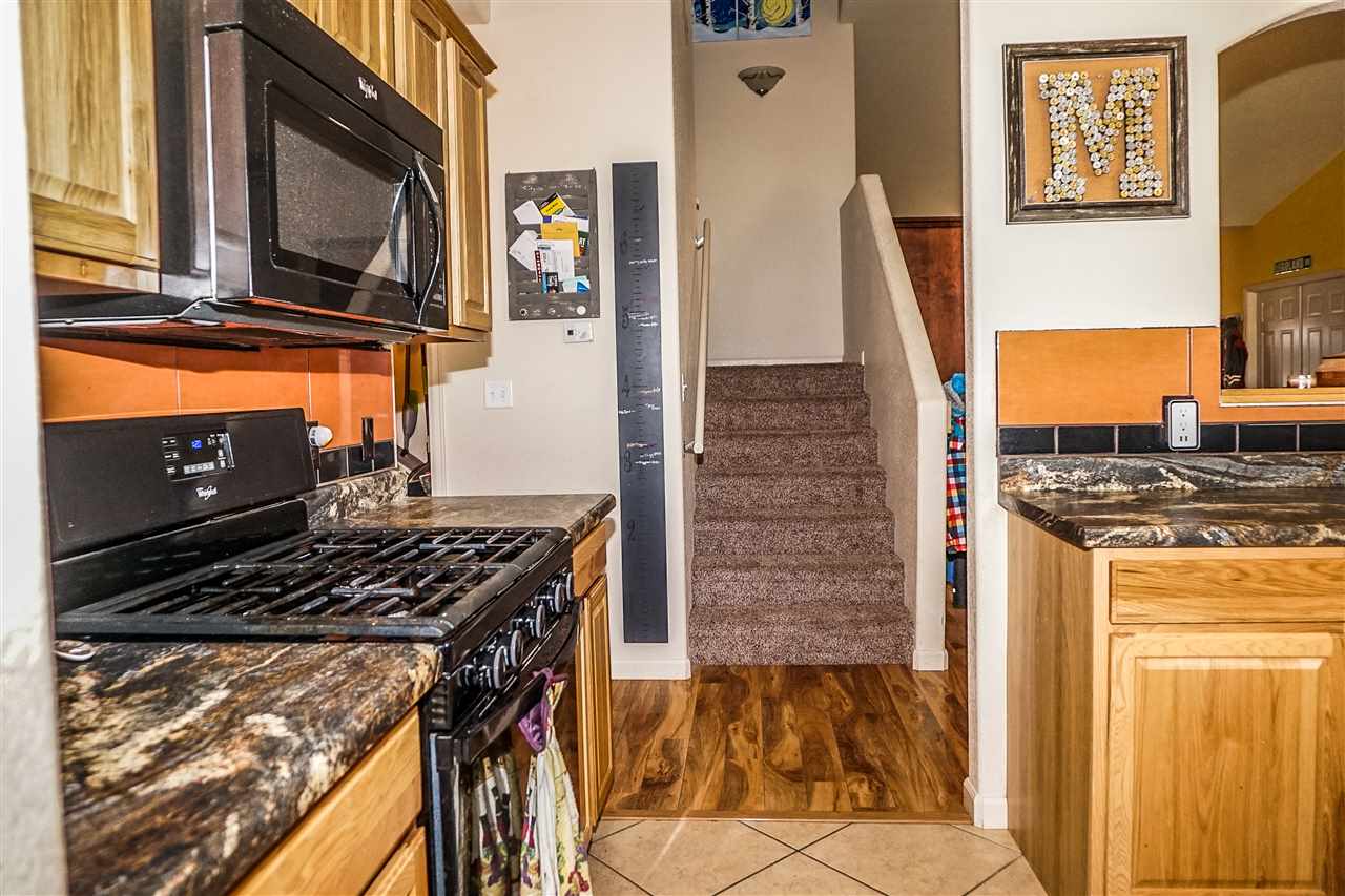 1860 Golden Ranch Road Fruita, CO 81521 - Photo 8 of 27 a kitchen with a stove and a microwave