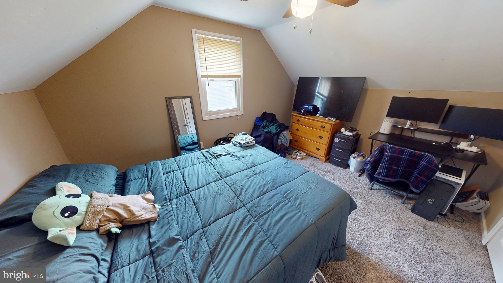 13 Cordelia Avenue Westville, NJ 08093 - Photo 13 of 25 a bedroom with a bed and wooden floor