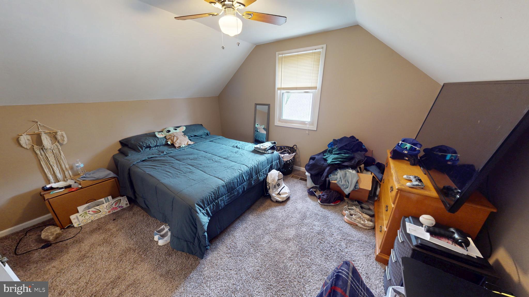 13 Cordelia Avenue Westville, NJ 08093 - Photo 15 of 25 a bed sitting in a bedroom next to a window