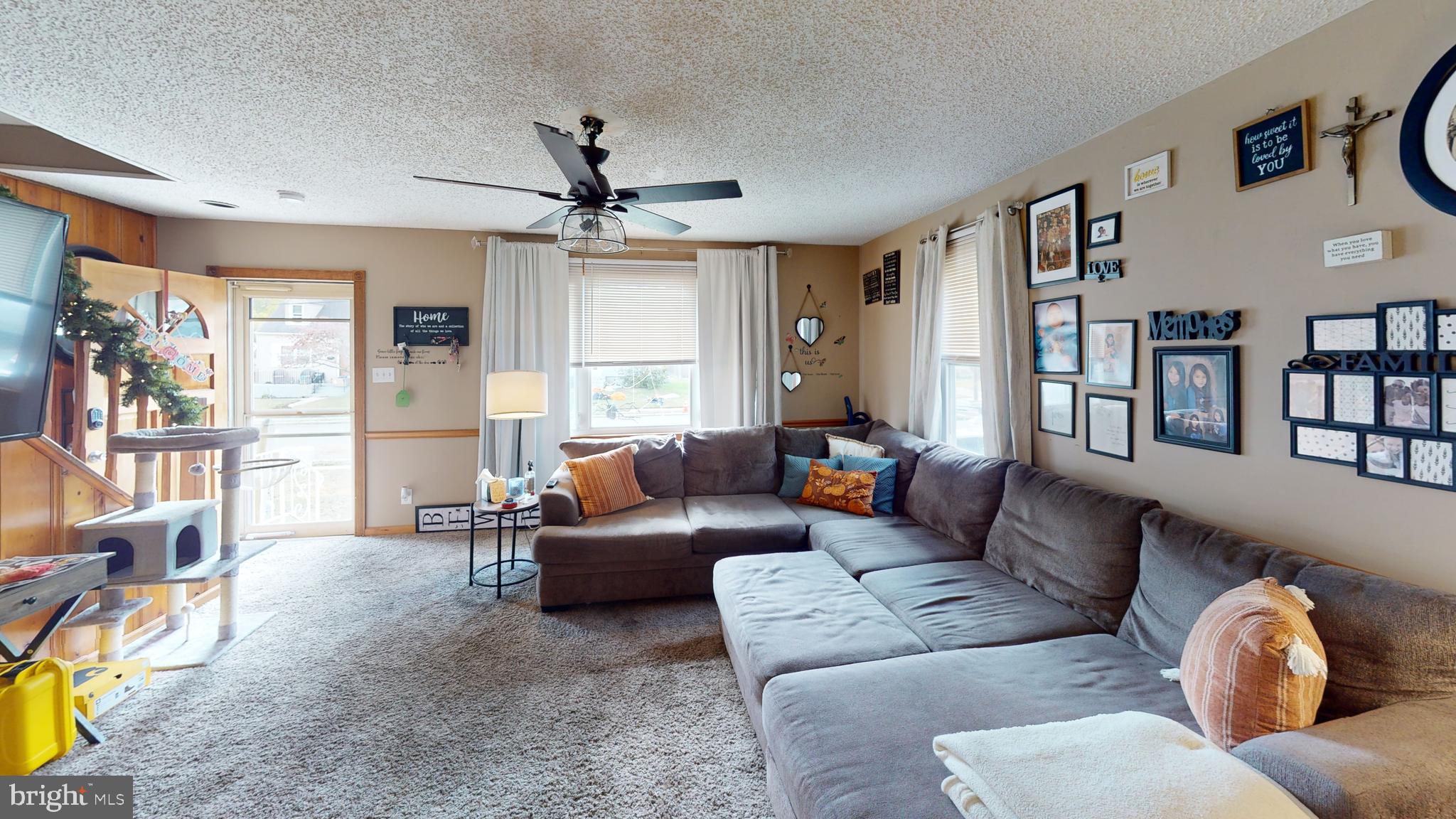 13 Cordelia Avenue Westville, NJ 08093 - Photo 3 of 25 a living room with furniture and a large window