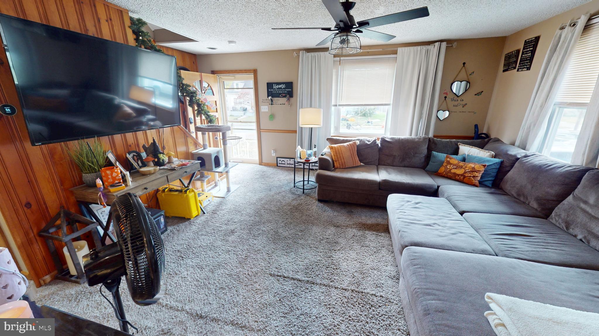 13 Cordelia Avenue Westville, NJ 08093 - Photo 4 of 25 a living room with furniture and a window