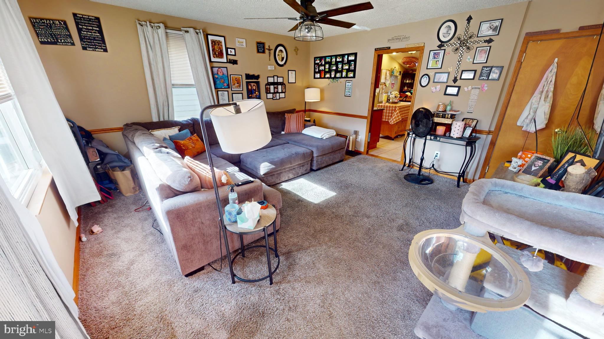 13 Cordelia Avenue Westville, NJ 08093 - Photo 5 of 25 a living room with furniture and a flat screen tv