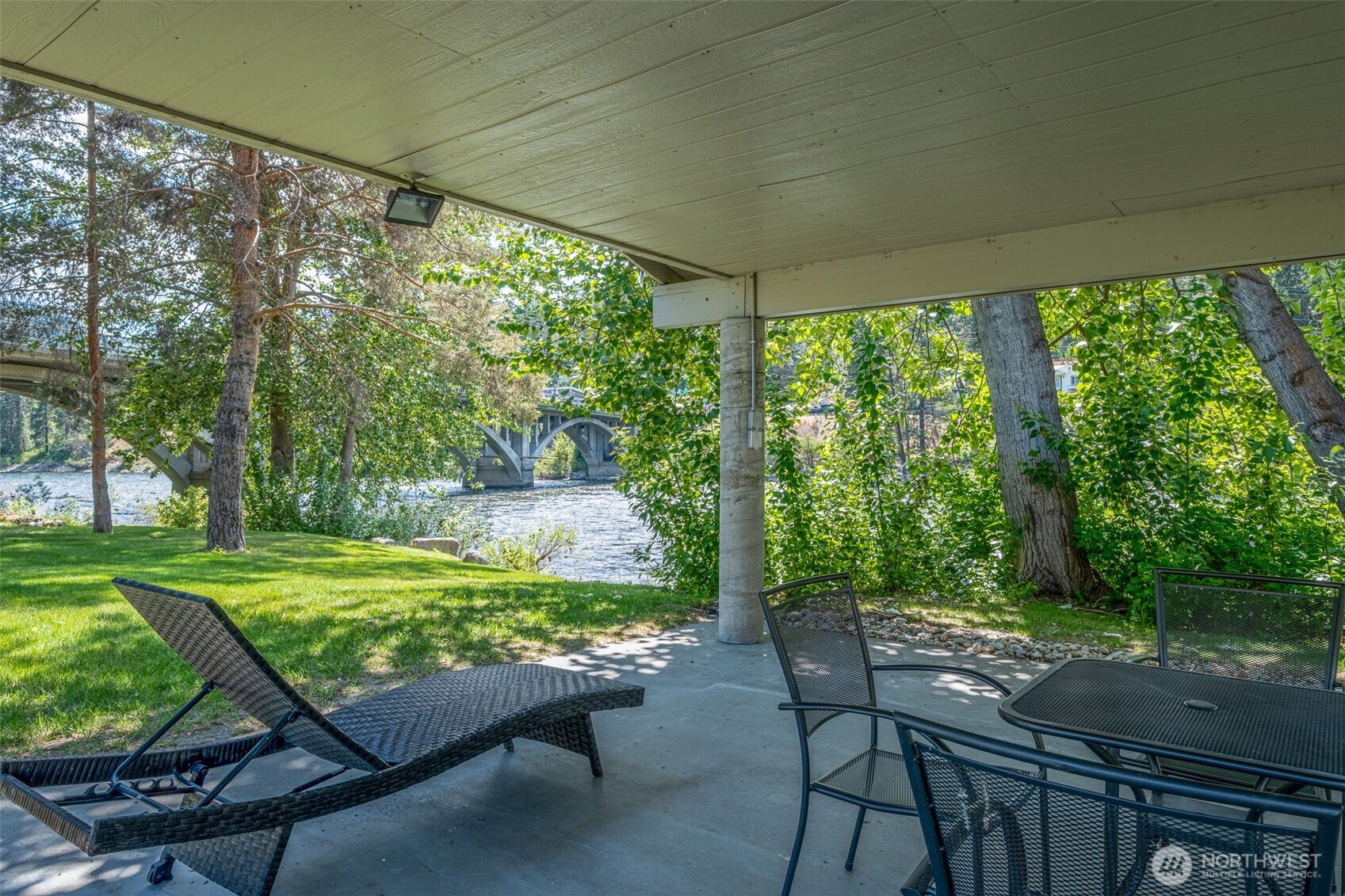 8348 Main Street, Unit 1 Peshastin, WA 98847 - Photo 19 of 40 a view of a porch with furniture and a yard