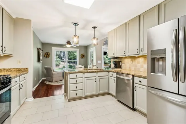 a spacious bedroom with a bed and a dresser