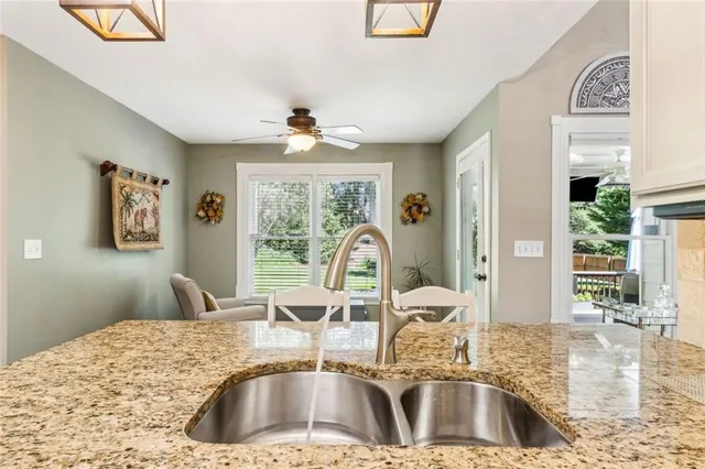 a spacious bedroom with a bed and a cabinets