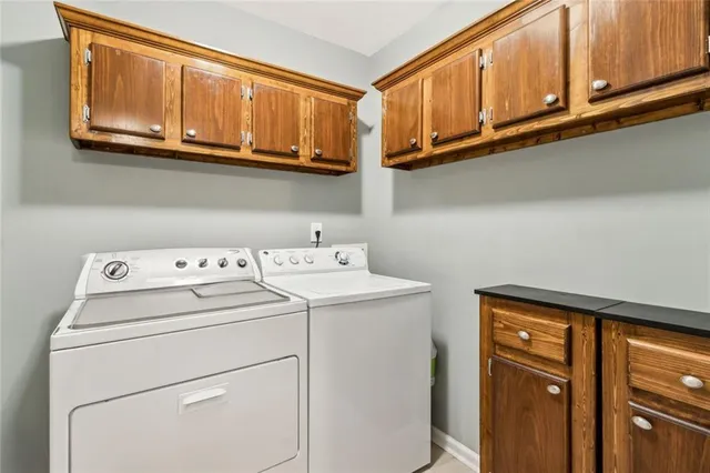 a white toilet sitting next to a bathroom sink