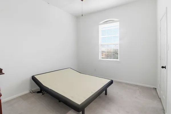 a room with a bed and a window