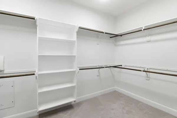 a view of an empty walk in closet