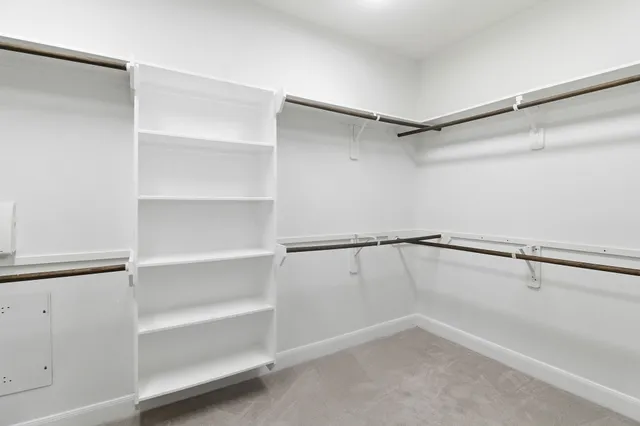 a view of an empty walk in closet