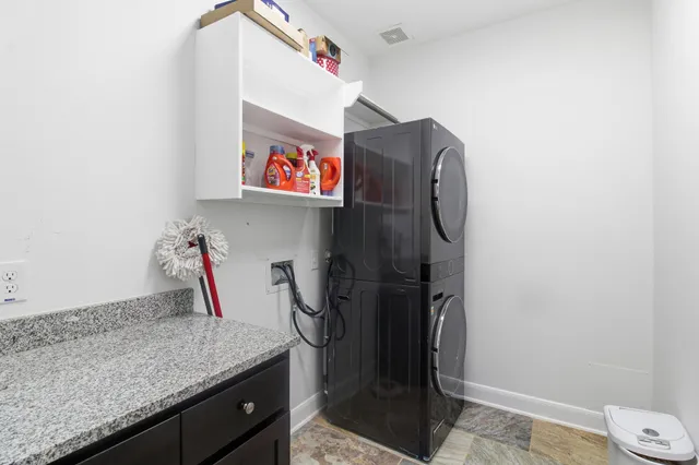 a utility room with cabinets and a sink