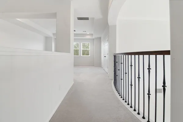 a view of a hallway with a window