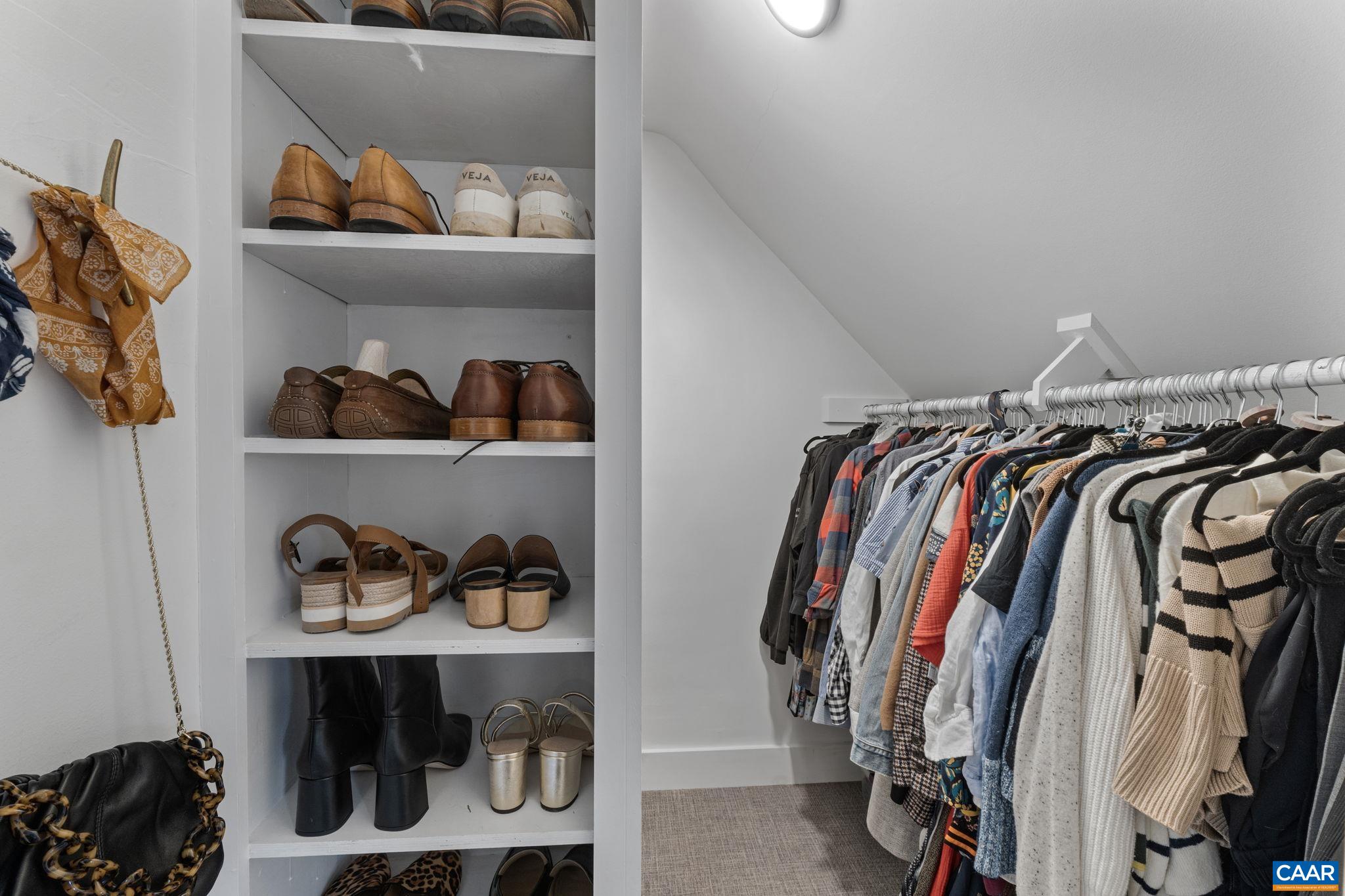 1105 Avon Street Charlottesville, VA 22902 - Photo 39 of 51 a view of walk in closet with clothes and shoes