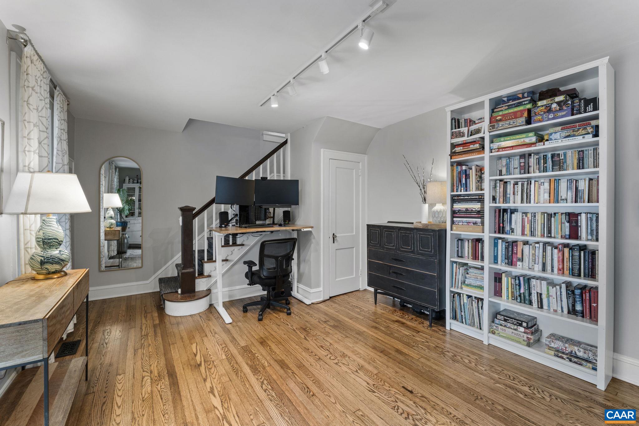 1105 Avon Street Charlottesville, VA 22902 - Photo 6 of 51 a view of a workspace with furniture and wooden floor