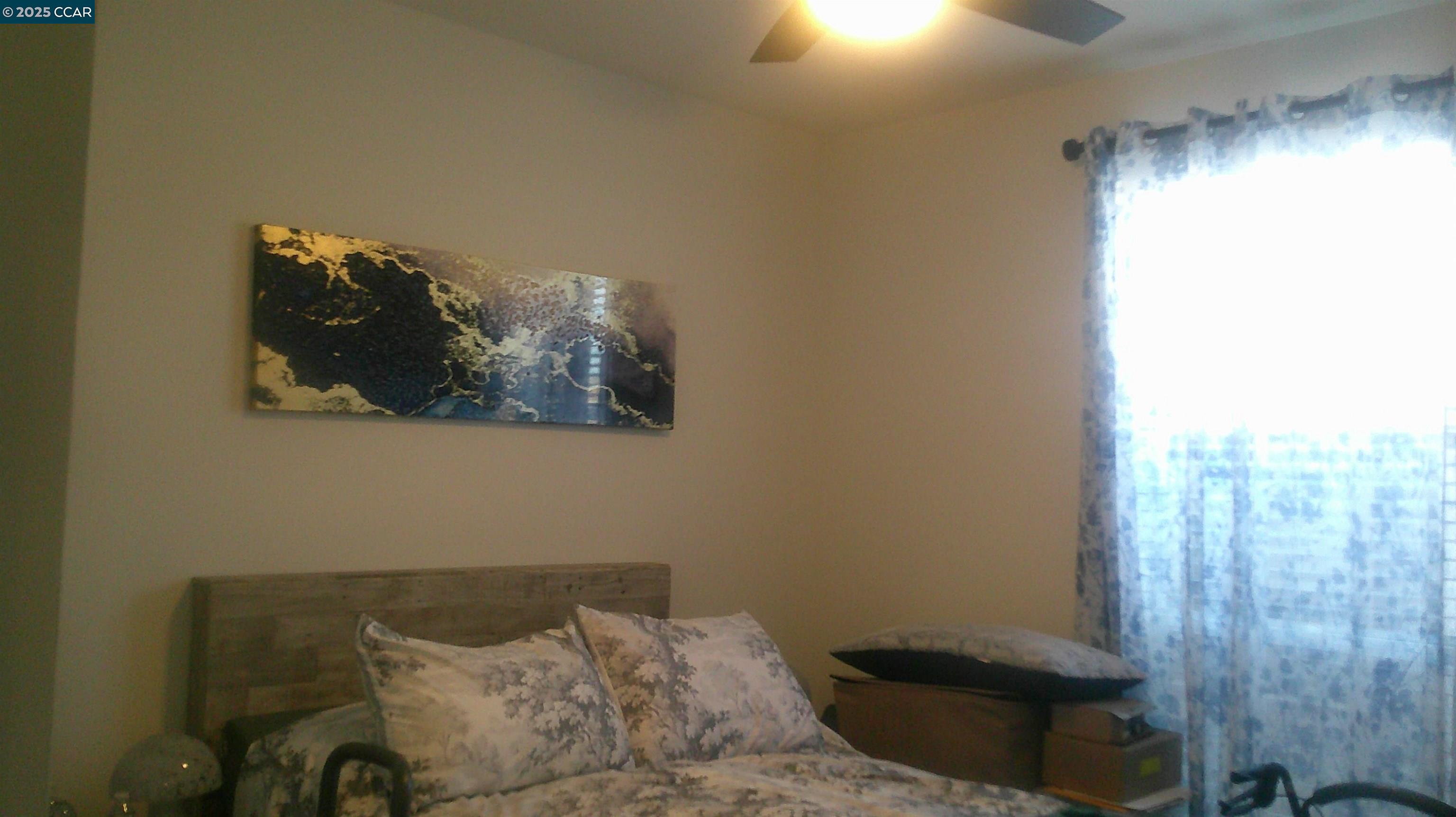 16711 Marsh Creek Road, Unit 161 Clayton, CA 94517 - Photo 14 of 25 a bed sitting in a bedroom next to a window