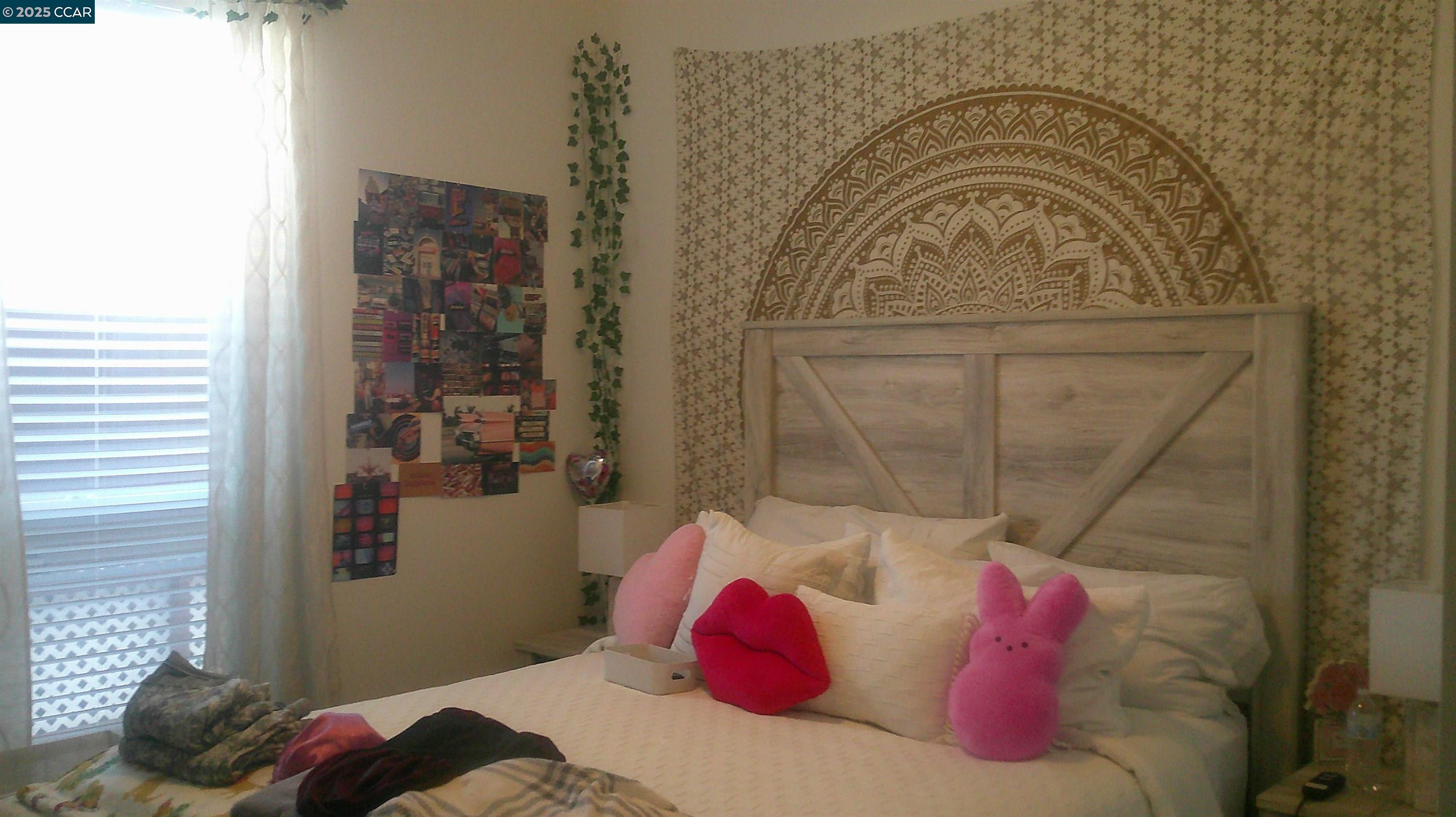 16711 Marsh Creek Road, Unit 161 Clayton, CA 94517 - Photo 15 of 25 a bedroom with a bed and a window