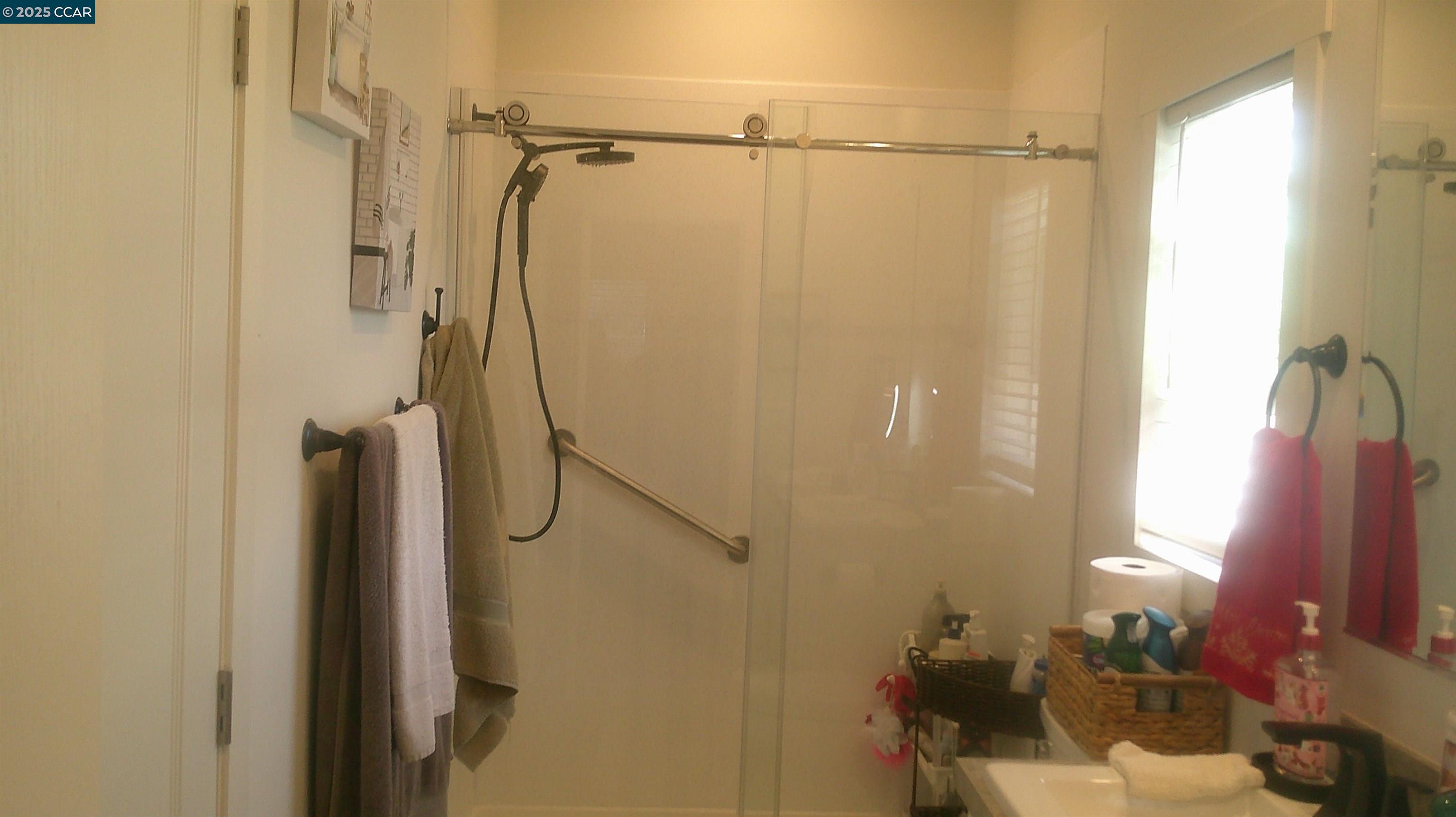 16711 Marsh Creek Road, Unit 161 Clayton, CA 94517 - Photo 17 of 25 a bathroom with a shower curtain and a window