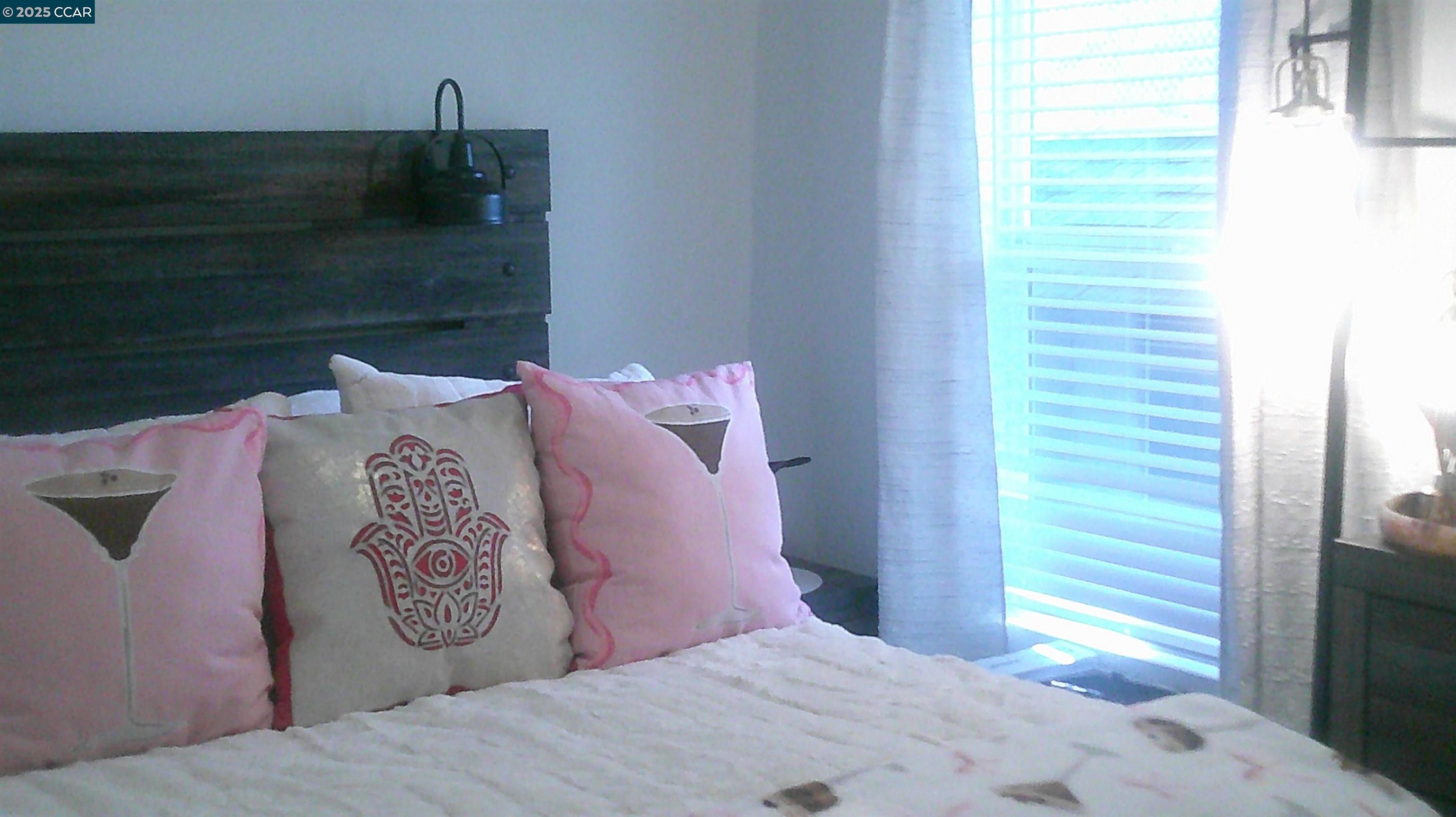 16711 Marsh Creek Road, Unit 161 Clayton, CA 94517 - Photo 19 of 25 a bedroom with a bed and a window