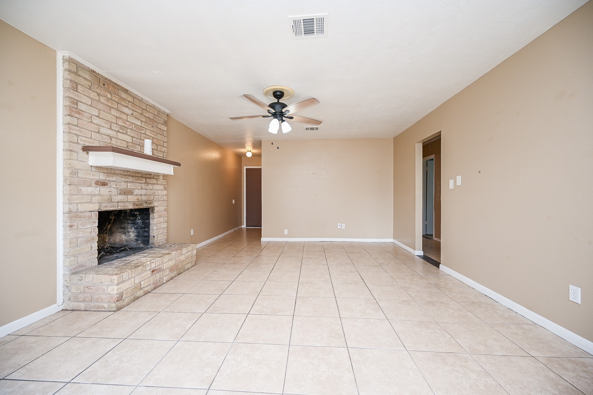 6634 Bridgegate Drive Spring, TX 77373 - Photo 10 of 16 a view of an empty room with a fireplace