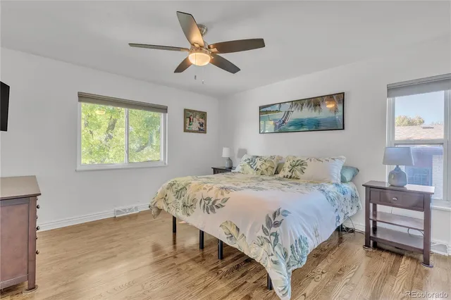 a bedroom with a bed and a table