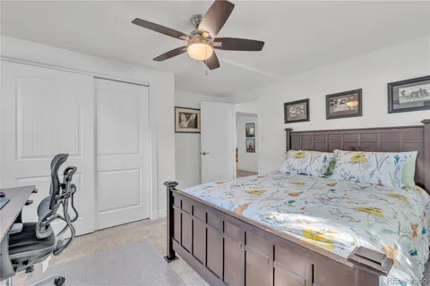 a bedroom with a bed and a table