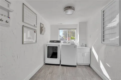 a kitchen with stainless steel appliances a white stove top oven and a refrigerator