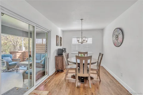 a view of a dining room with furniture window and wooden floor