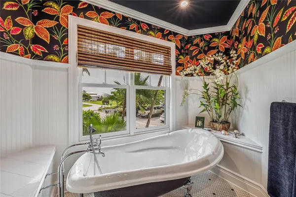 a bath tub sitting next to a window