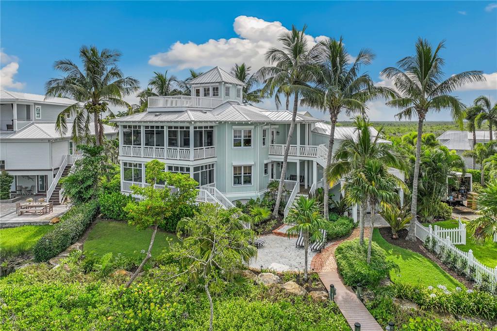 13310 Anglers Way Placida, FL 33946 - Photo 2 of 43 a view of a house with a garden and a yard