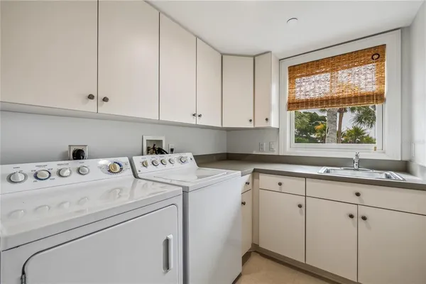 a view of storage and utility room with washer and dryer