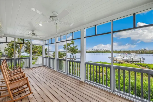 a view of a balcony with furniture