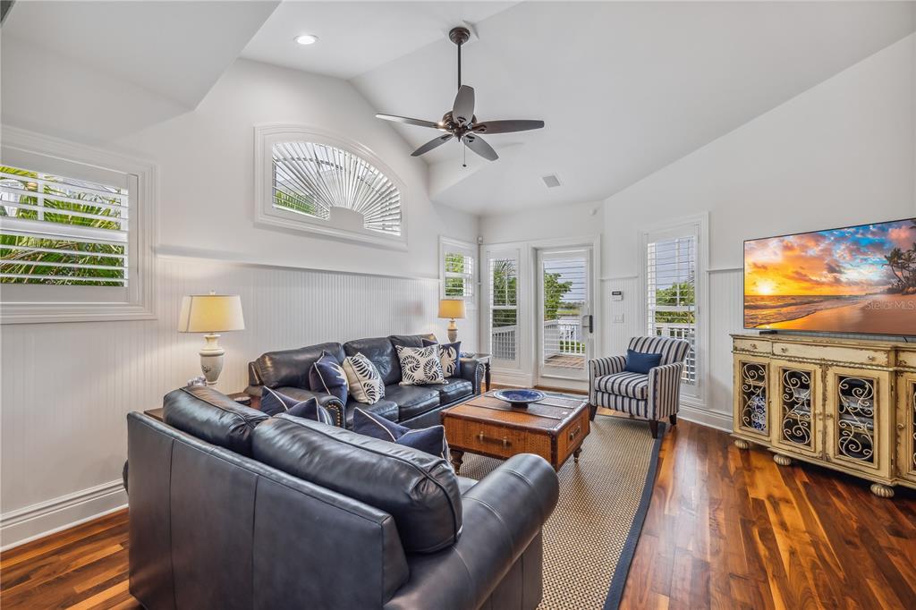 13310 Anglers Way Placida, FL 33946 - Photo 31 of 43 a living room with furniture and a flat screen tv