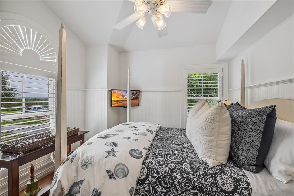 13310 Anglers Way Placida, FL 33946 - Photo 32 of 43 a bed sitting in a bedroom next to a window