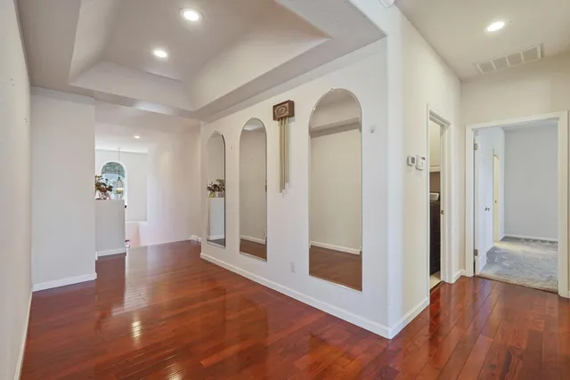 wooden floor in a hall with an entryway